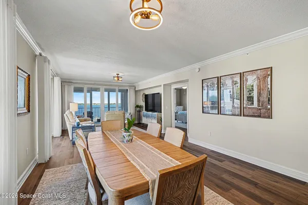 a view of a livingroom with workspace and a window