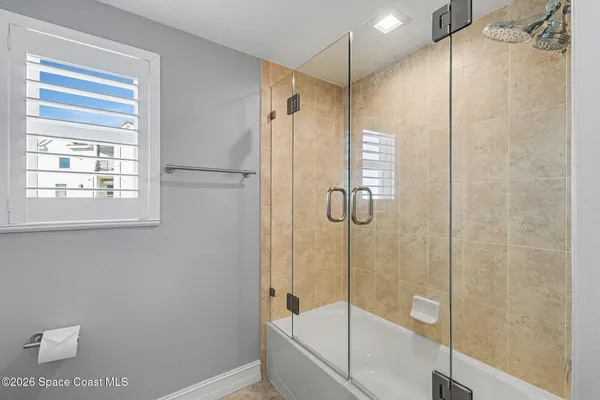 a front view of house with a garden