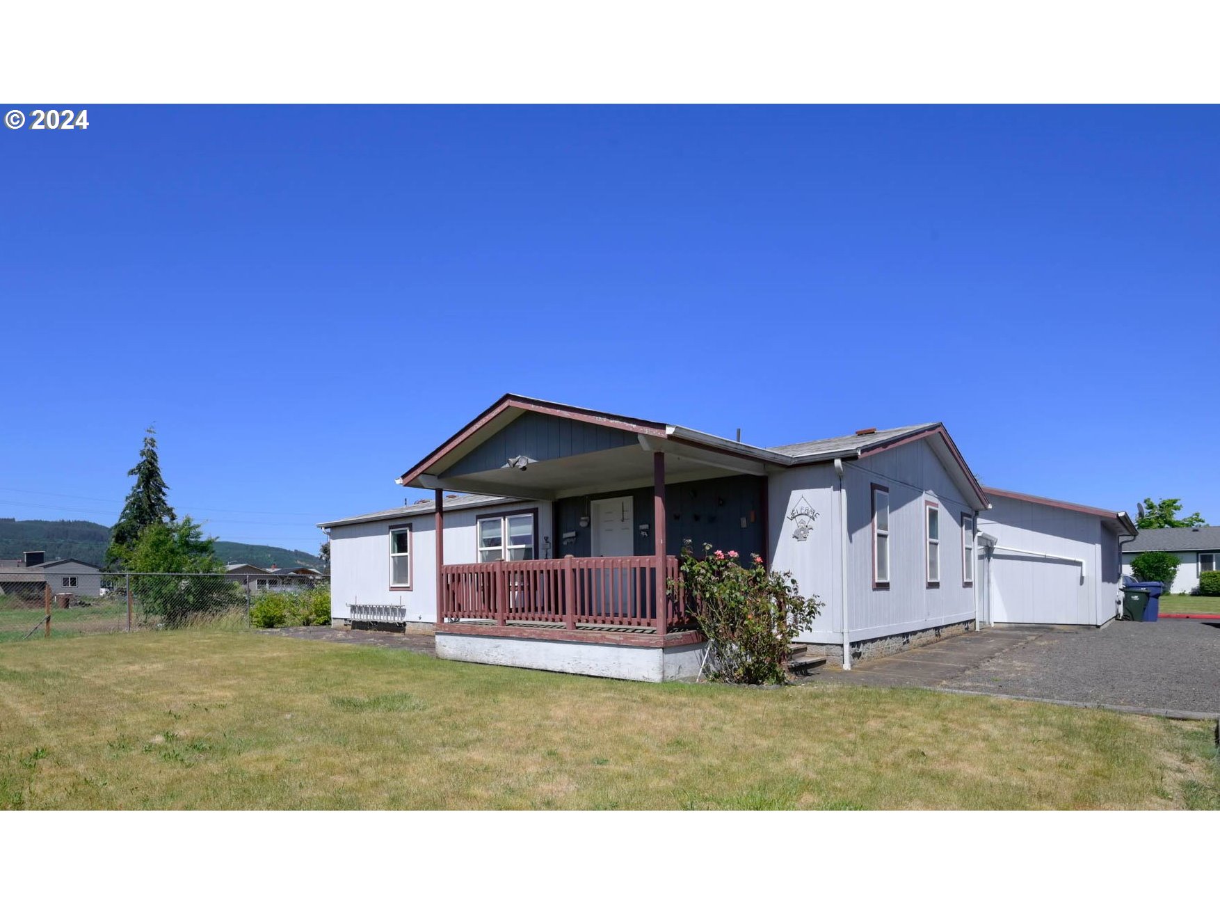 2394 Maia Loop Springfield, OR 97477 - Photo 18 of 19 a view of a house with a backyard
