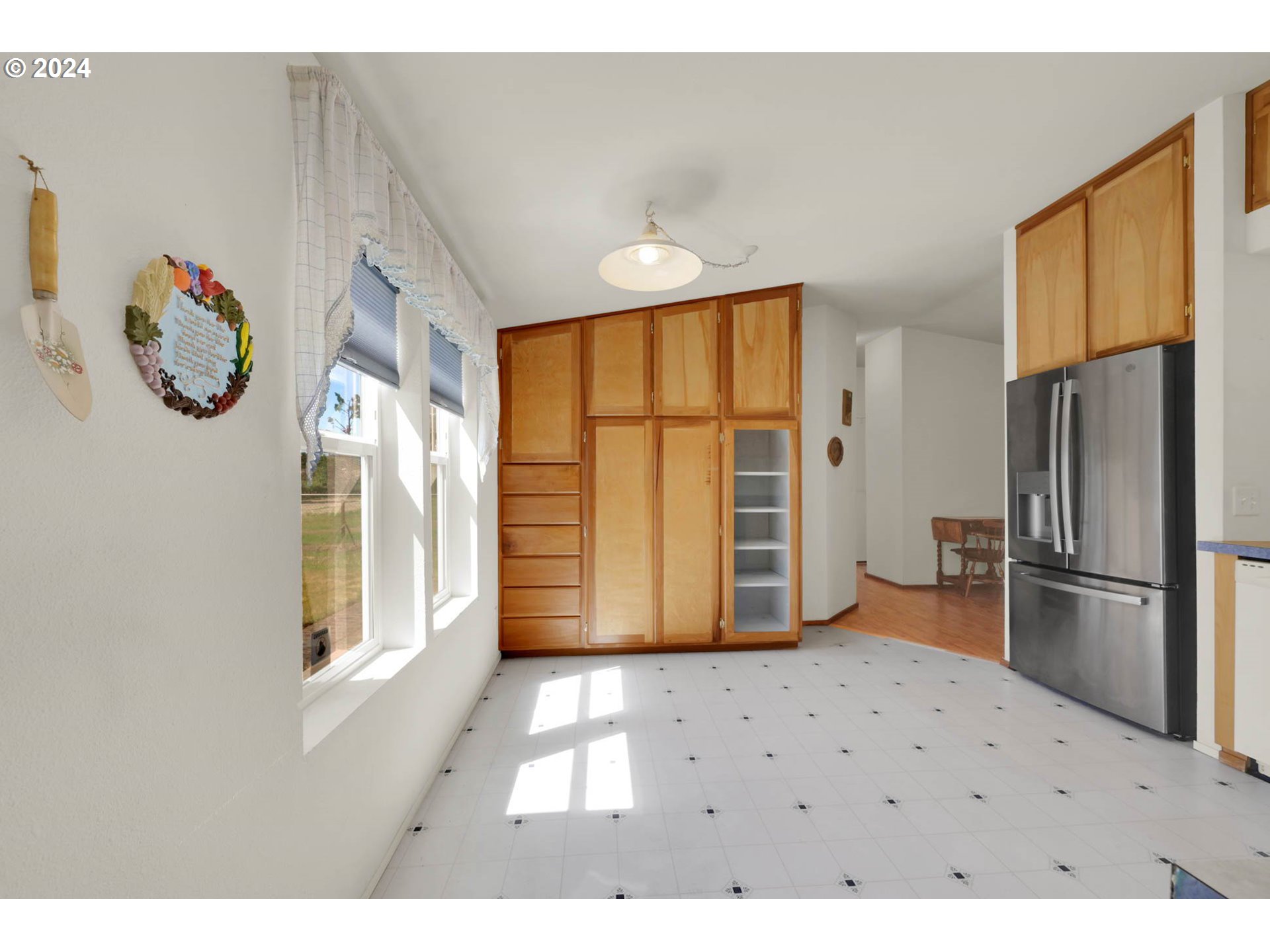 2394 Maia Loop Springfield, OR 97477 - Photo 8 of 19 a view of a refrigerator in kitchen and a window