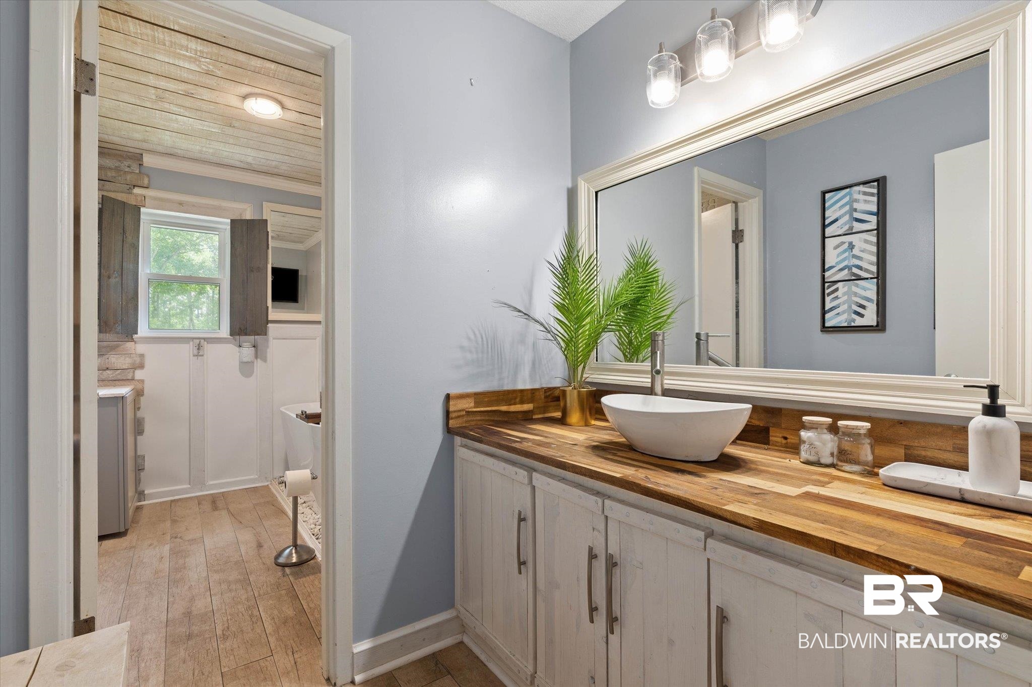 1025 Walter Smith Road Mobile, AL 36695 - Photo 16 of 46 Bathroom with vanity and hardwood / wood-style flooring