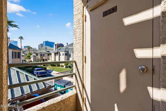 a view of a balcony with chairs