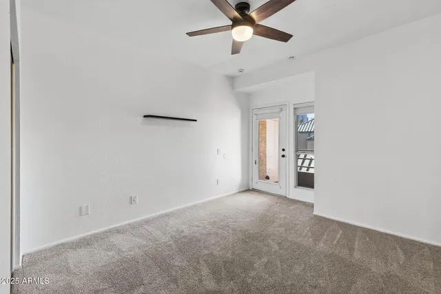 an empty room with fan