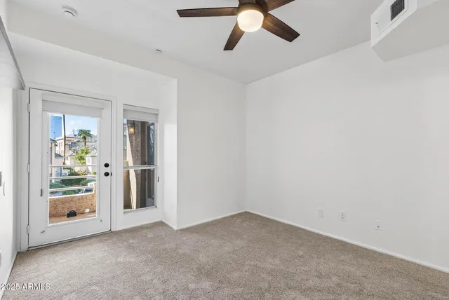 a view of a walk in closet and living room
