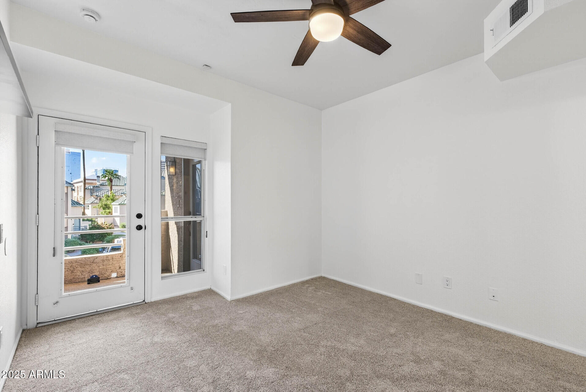 101 North 7th Street, Unit 245 Phoenix, AZ 85034 - Photo 29 of 37 an empty room with fan and windows