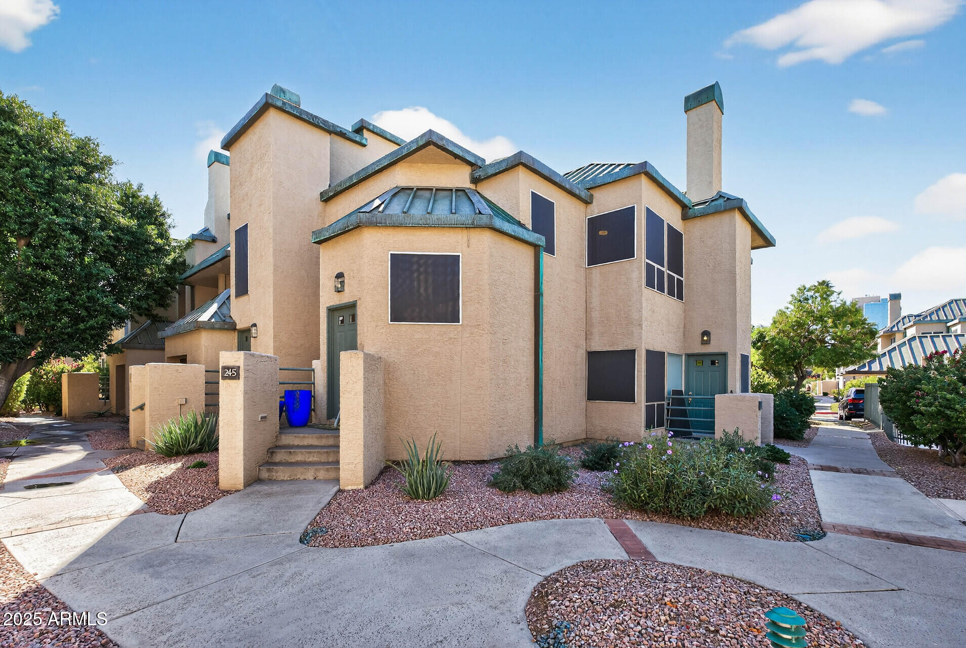 101 North 7th Street, Unit 245 Phoenix, AZ 85034 - Photo 3 of 37 a front view of a house with garden