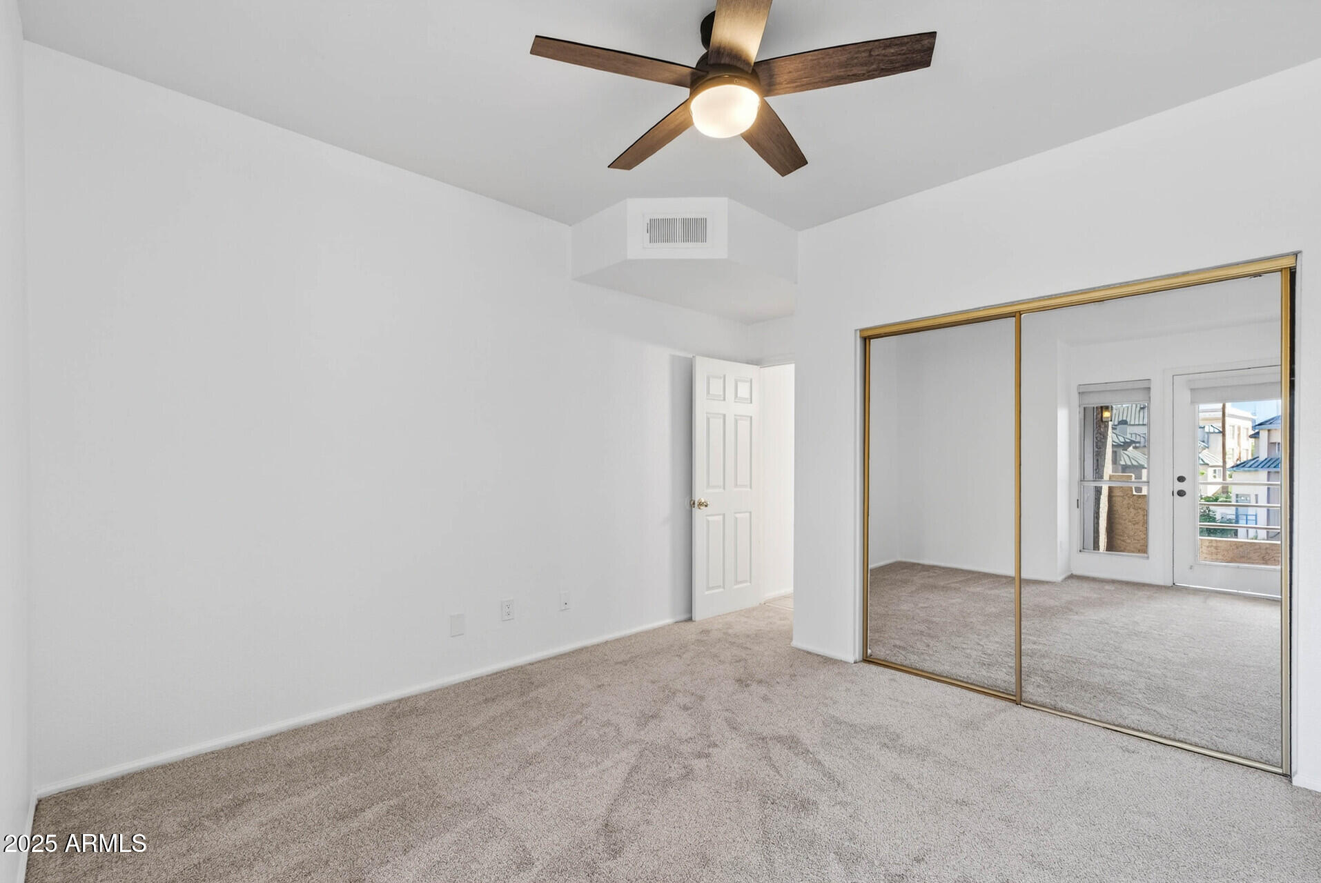101 North 7th Street, Unit 245 Phoenix, AZ 85034 - Photo 32 of 37 en empty room with fan and window