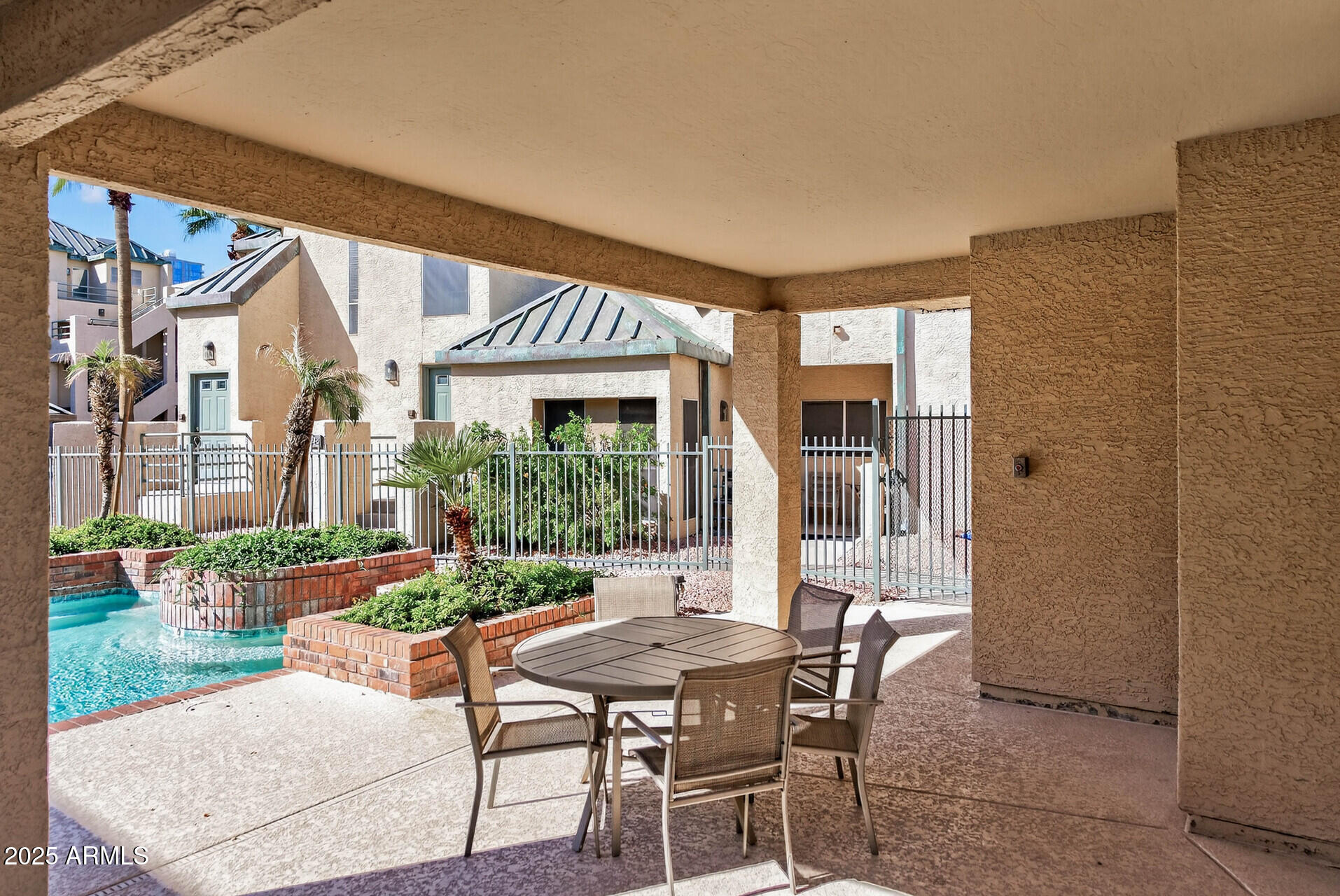 101 North 7th Street, Unit 245 Phoenix, AZ 85034 - Photo 36 of 37 a patio with table and chairs