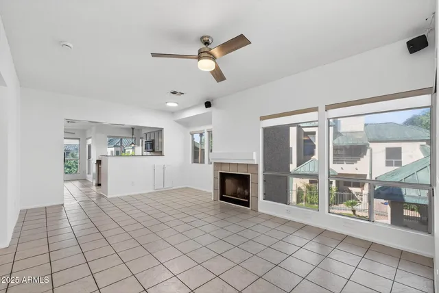 a view of a big room with windows and cabinet
