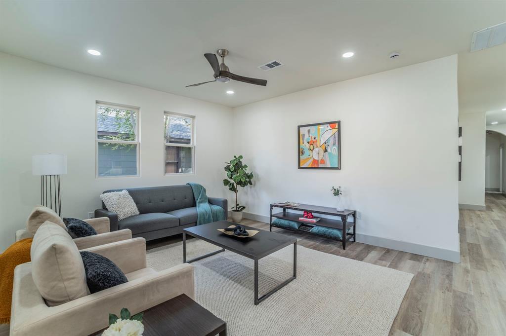 5914 Victor Street Dallas, TX 75214 - Photo 3 of 32 a living room with furniture and a wooden floor
