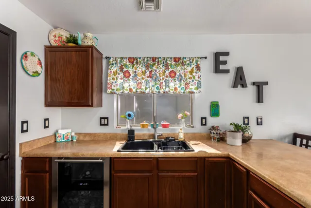 a kitchen with stainless steel appliances a sink dishwasher and a microwave oven
