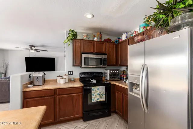 a kitchen with a refrigerator sink and microwave