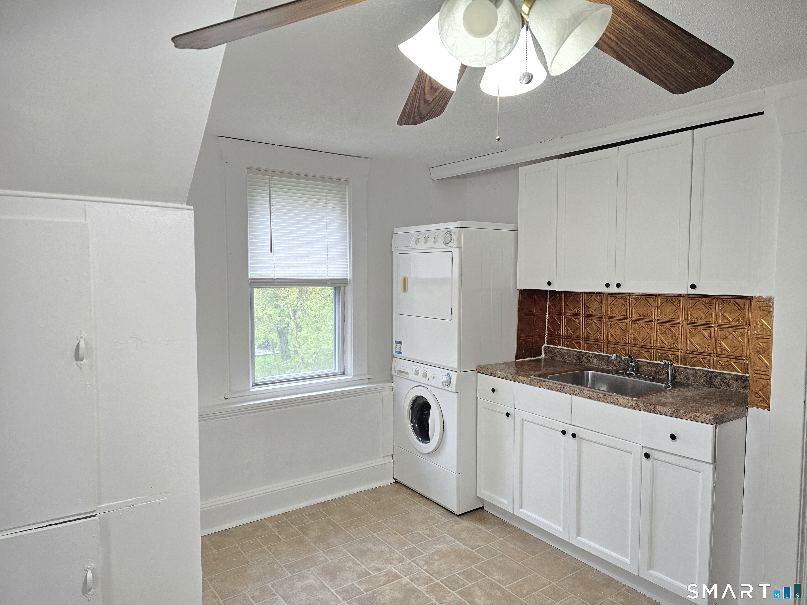 103 Capen Street, Unit 2 Windsor, CT 06095 - Photo 2 of 10 a kitchen with cabinets and window
