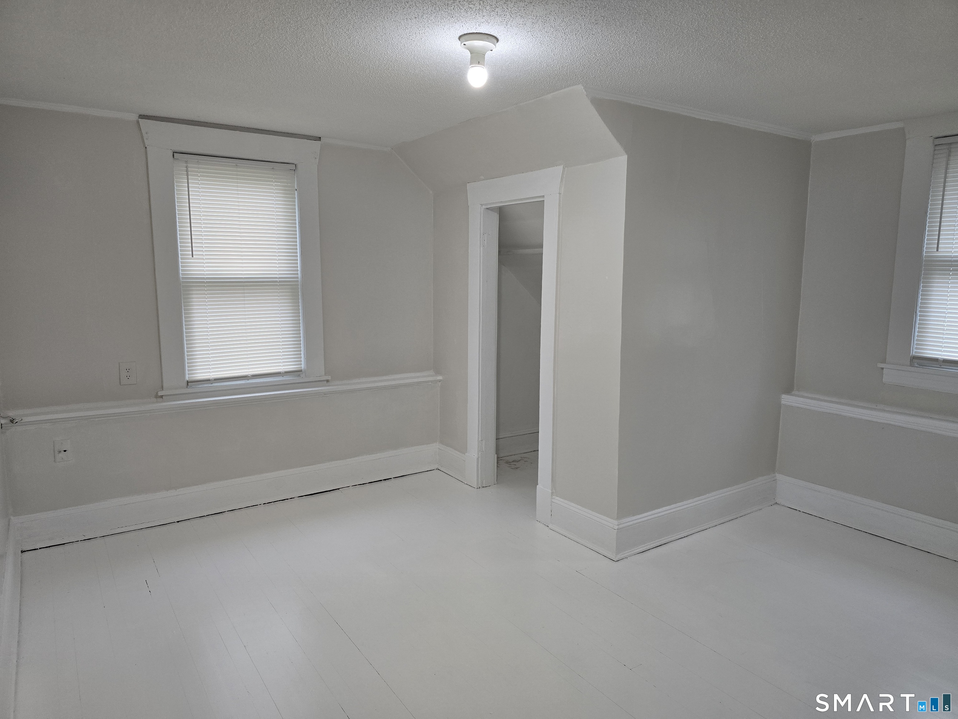 103 Capen Street, Unit 2 Windsor, CT 06095 - Photo 6 of 10 a view of an empty room with a window