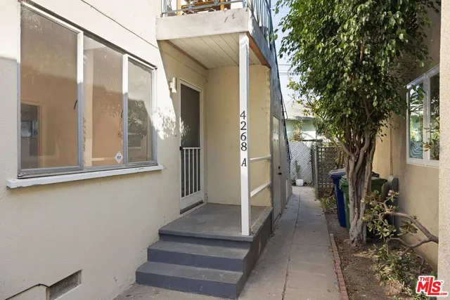 a view of a porch with wooden floor and stairs