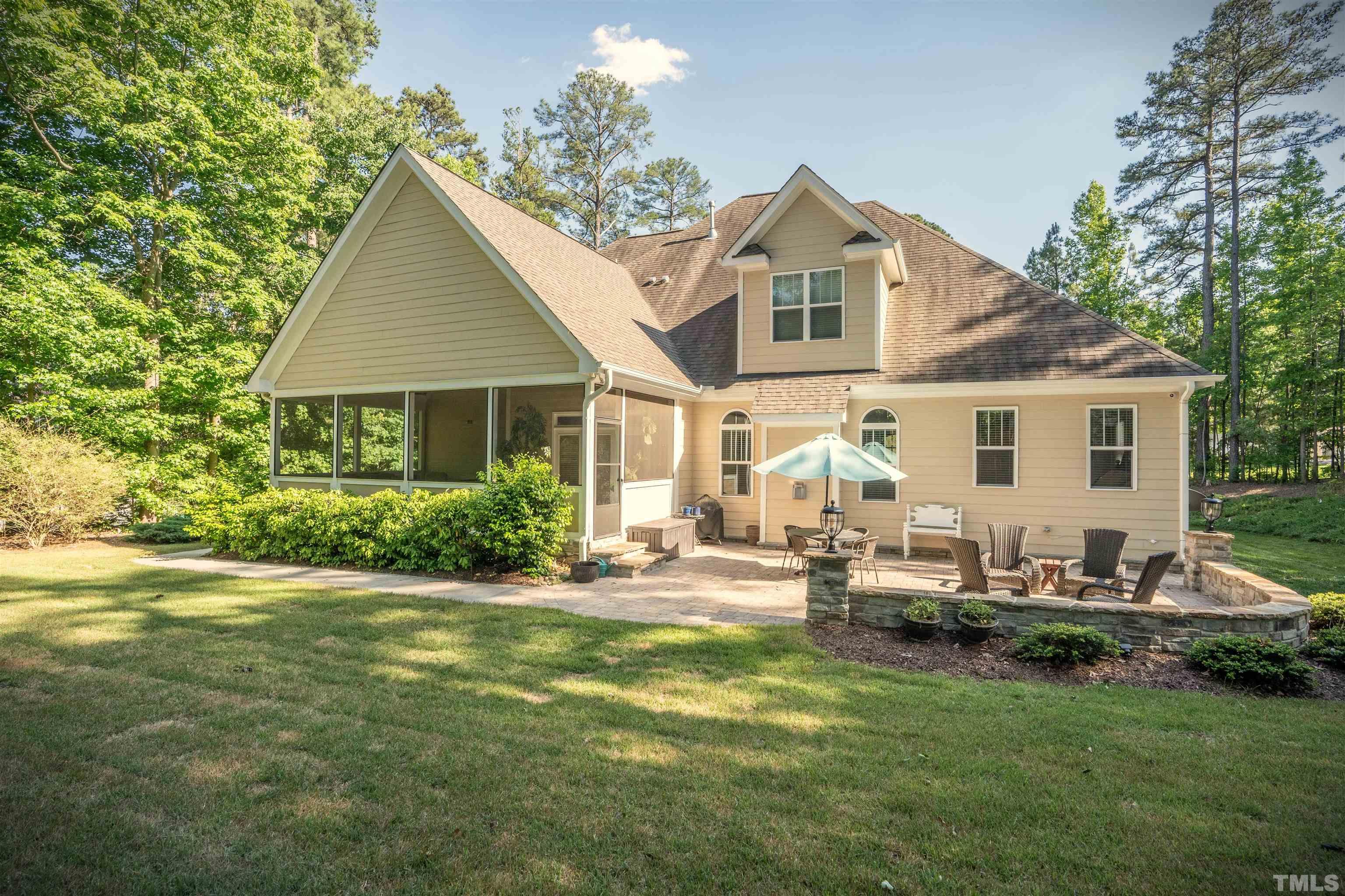 232 Bayleaf Drive Raleigh, NC 27615 - Photo 21 of 26 a front view of a house with a garden and patio