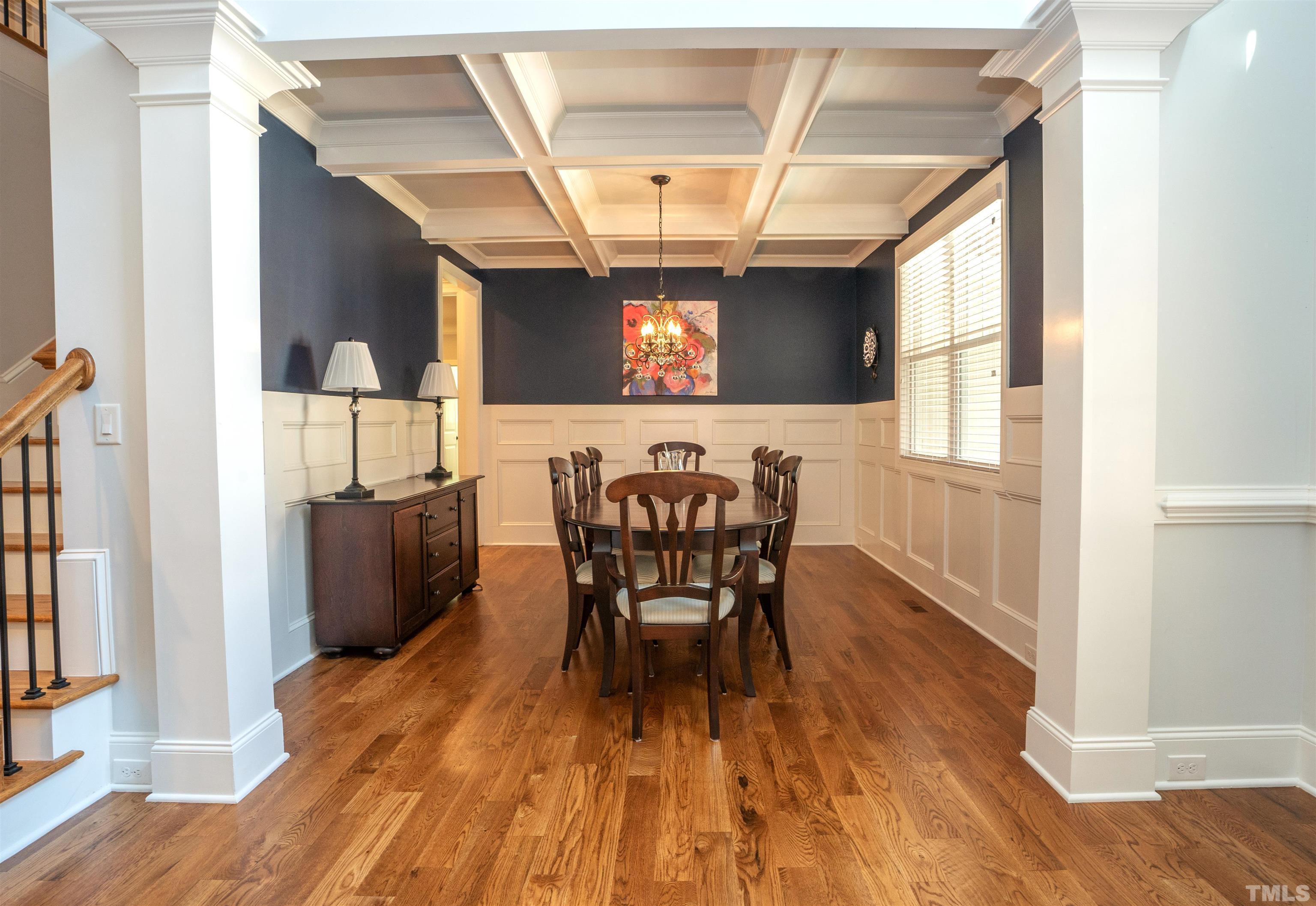 232 Bayleaf Drive Raleigh, NC 27615 - Photo 3 of 26 a view of a dining room with furniture and wooden floor