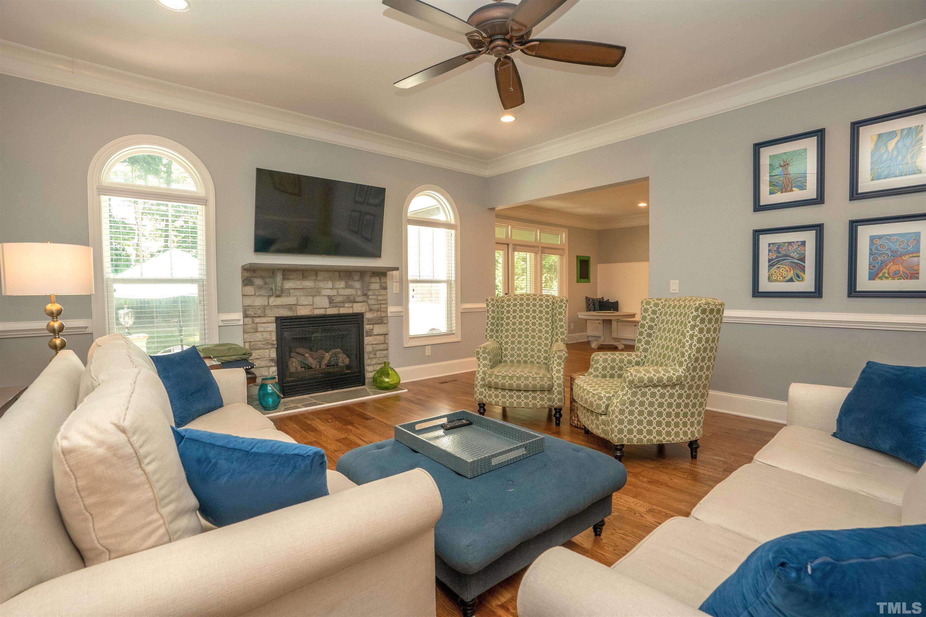 232 Bayleaf Drive Raleigh, NC 27615 - Photo 26 of 26 a living room with furniture fireplace and a flat screen tv