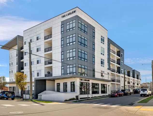 a front view of a building with street view