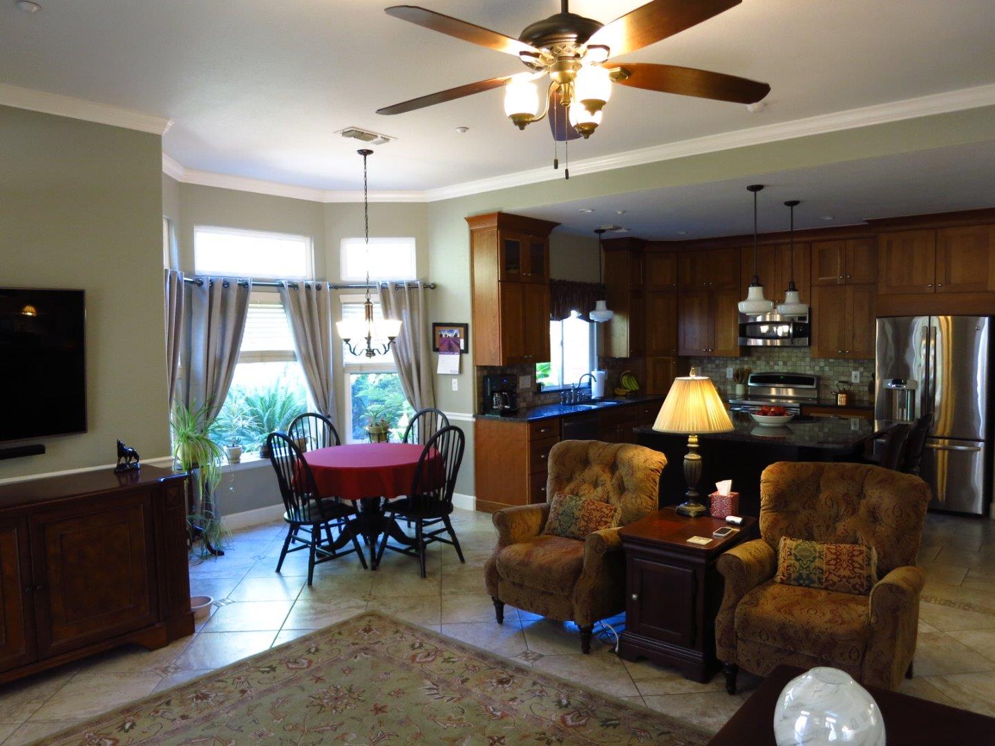 1847 Tartan Road Turlock, CA 95382 - Photo 27 of 37 a living room with furniture a chandelier and a window