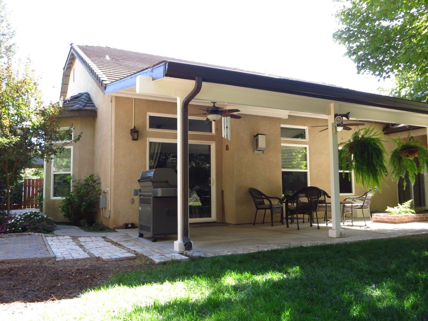 1847 Tartan Road Turlock, CA 95382 - Photo 5 of 37 a view of a house with backyard porch and sitting area