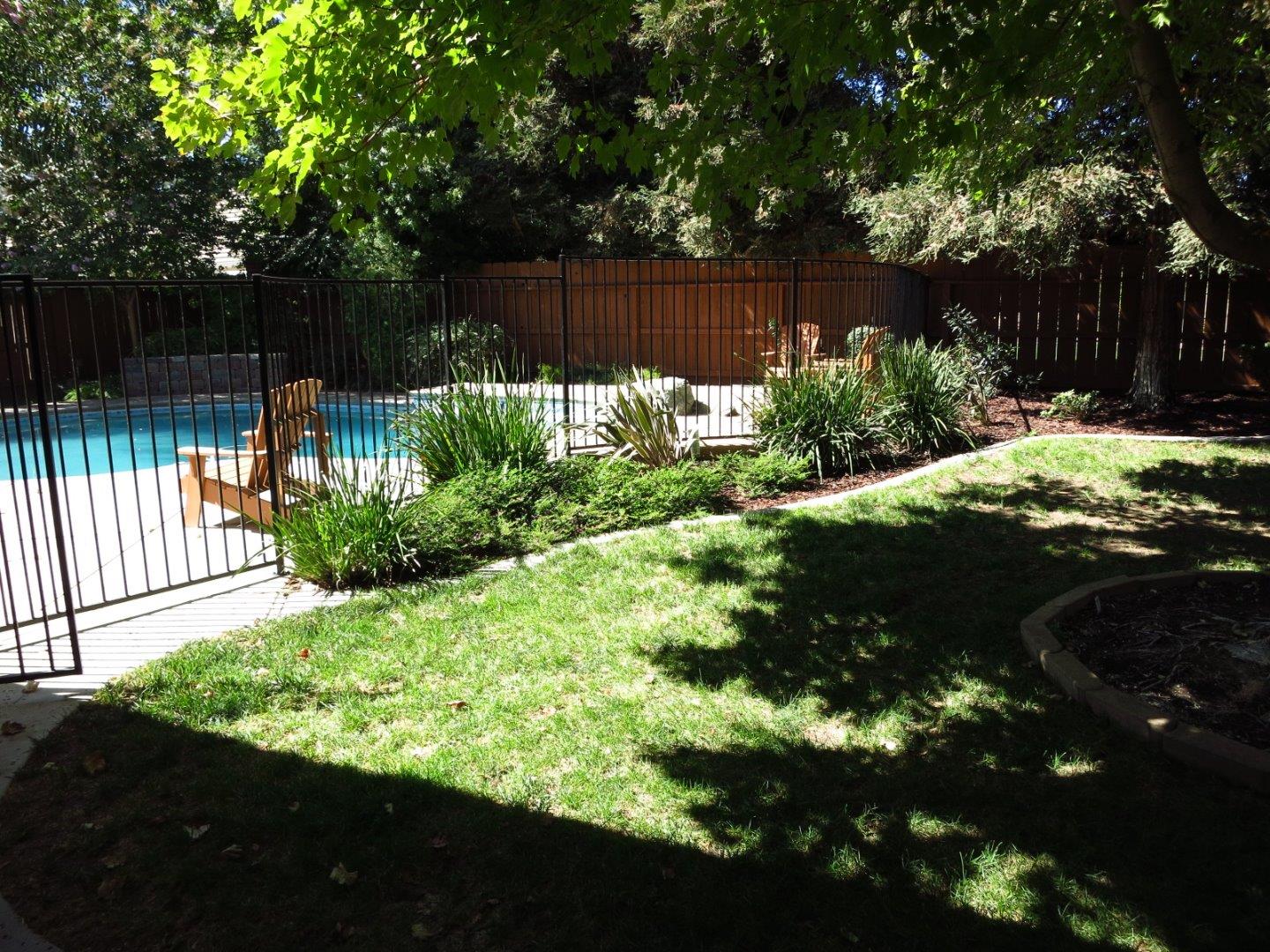 1847 Tartan Road Turlock, CA 95382 - Photo 8 of 37 a view of a backyard with pathway