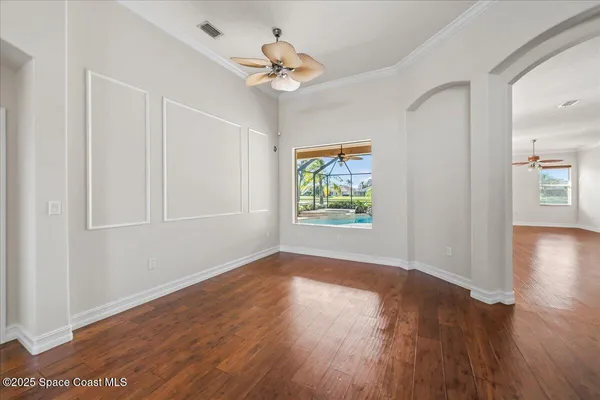 a view of kitchen with cabinets and wooden floor