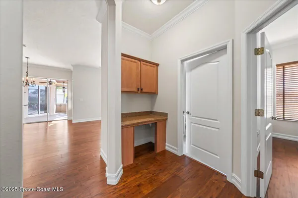 a view of a patio with a table and chairs