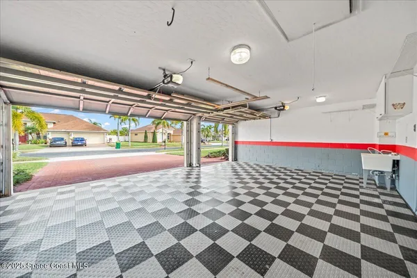 an aerial view of a house with a lake view
