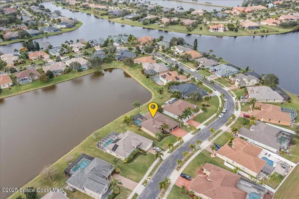 a view of a lake with houses in the back