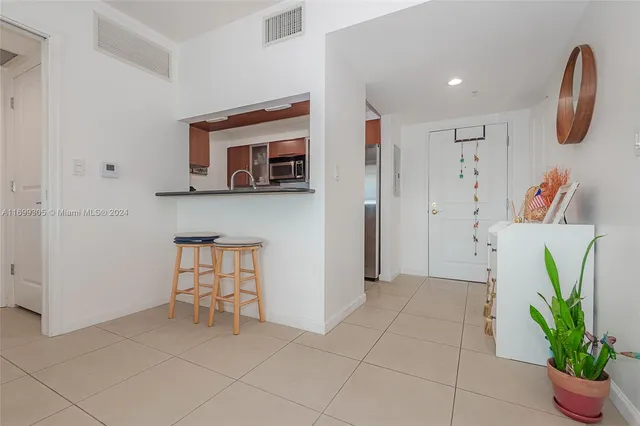 a view of kitchen with furniture and a potted plant