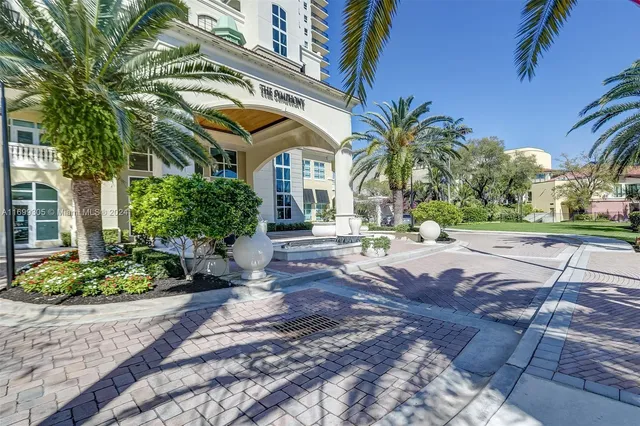 a view of a hall with an entrance and door