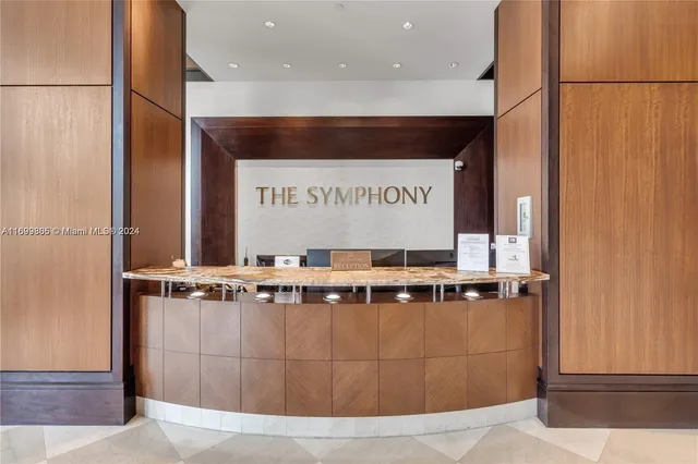 a view of a staircase with a clock on a wall