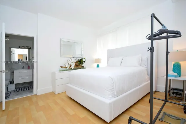 a bedroom with a bed and a table