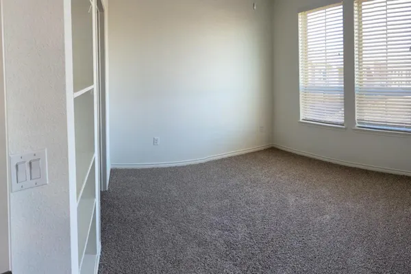 an empty room with windows