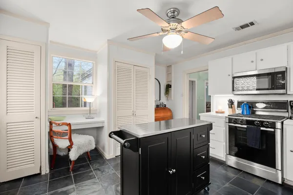 a kitchen with a cabinets and window