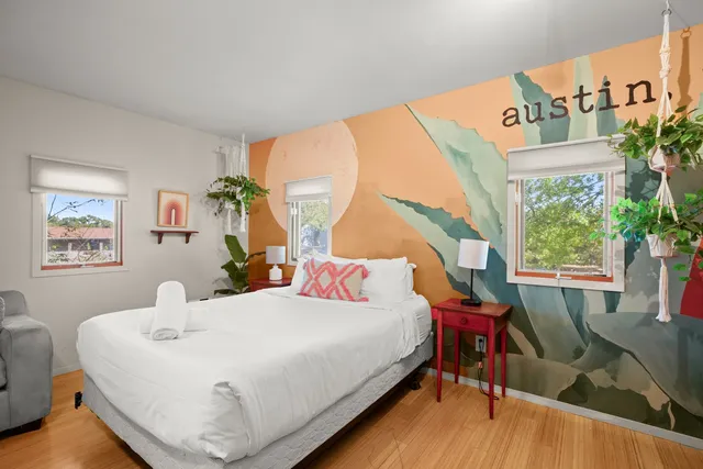 a bedroom with a bed and a table