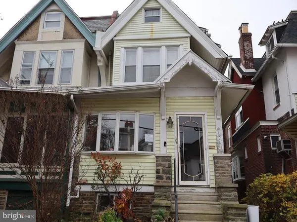 a front view of a house with glass windows