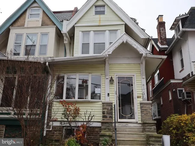 a front view of a house with glass windows
