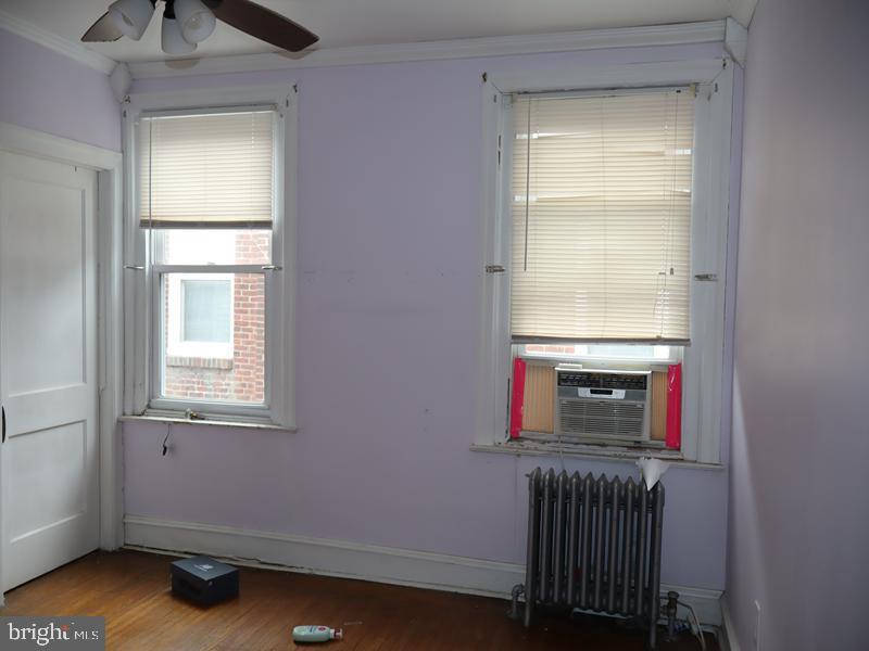 1502 68th Avenue Philadelphia, PA 19126 - Photo 14 of 20 a room with a fireplace and a window