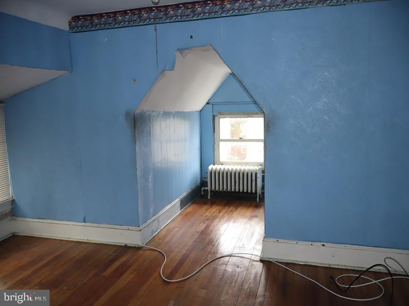 1502 68th Avenue Philadelphia, PA 19126 - Photo 15 of 20 a view of a room with wooden floor and windows