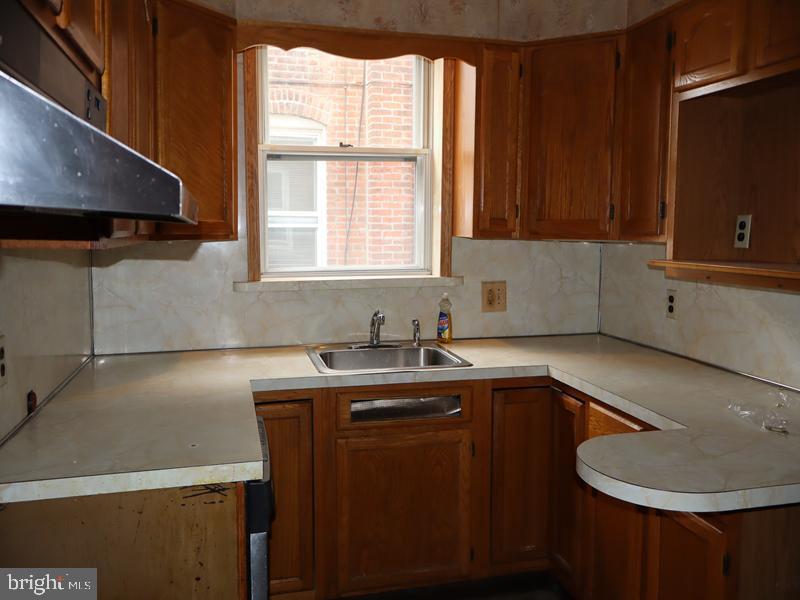 1502 68th Avenue Philadelphia, PA 19126 - Photo 10 of 20 a kitchen with a sink a window and cabinets