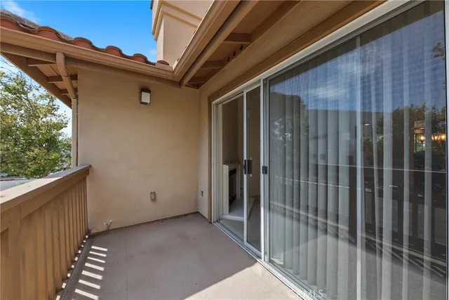 a bathroom with a granite countertop sink two mirror and a