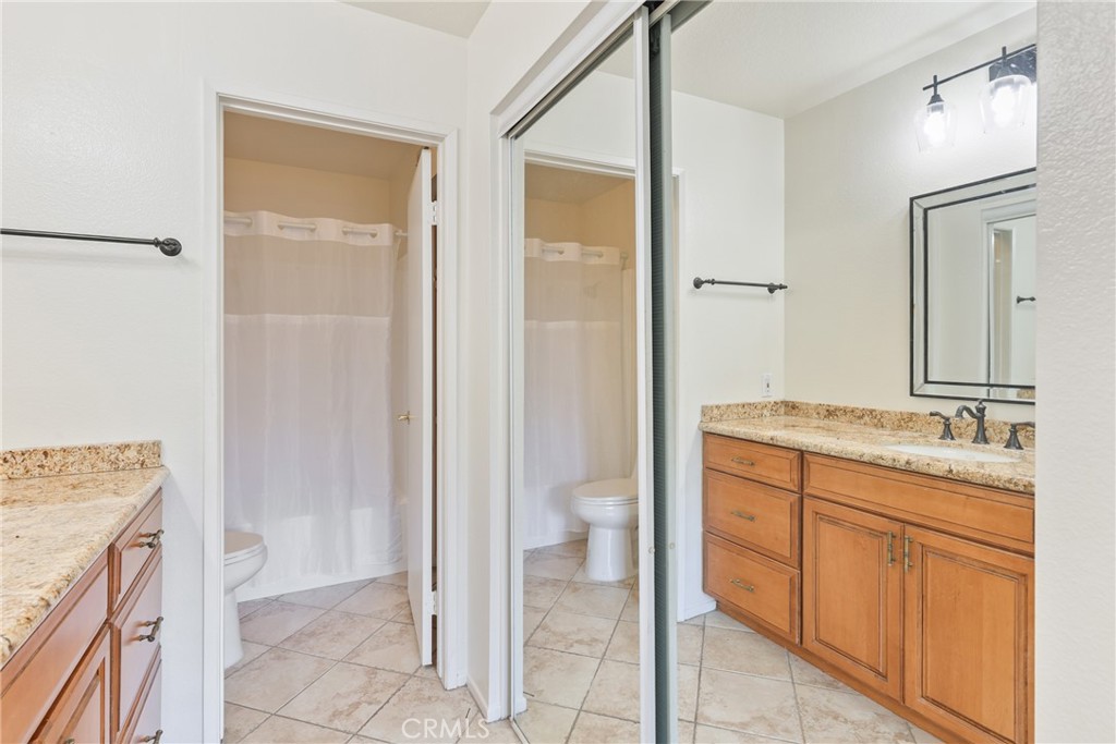 14 Abrigo Rancho Santa Margarita, CA 92688 - Photo 15 of 31 a bathroom with a granite countertop sink two mirror and a