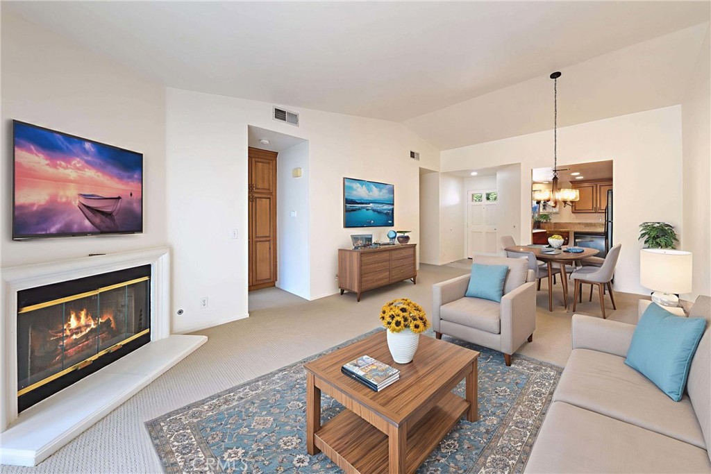 14 Abrigo Rancho Santa Margarita, CA 92688 - Photo 6 of 31 a living room with furniture a fireplace and a flat screen tv