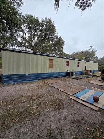 a view of a backyard of the house