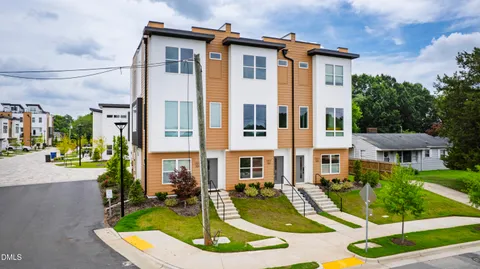 a view of a building with a yard