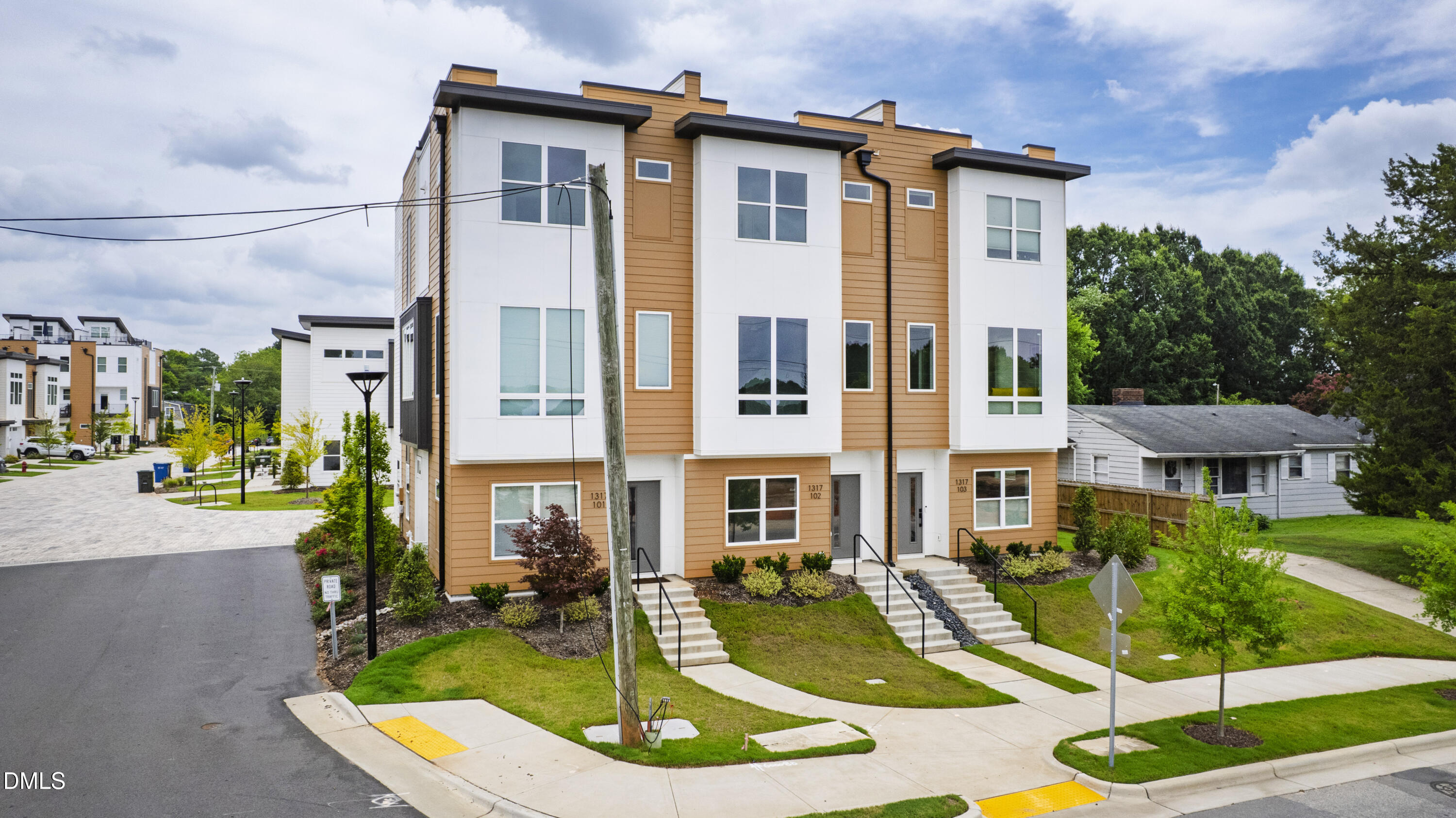 1317 Garner Road, Unit 102 Raleigh, NC 27610 - Photo 1 of 44 a view of a building with a yard