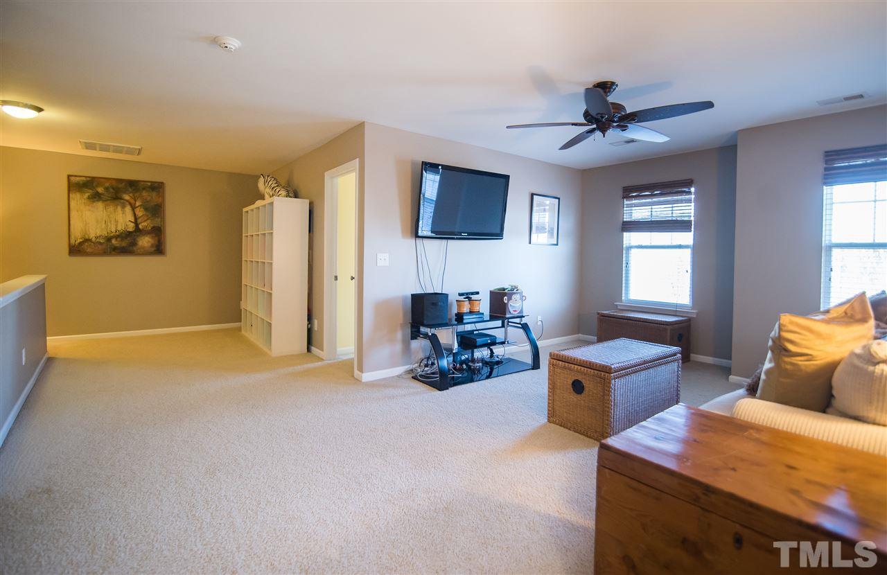 2307 Bright Future Way Raleigh, NC 27614 - Photo 13 of 23 With plush carpet, ceiling fan and natural light, this bonus room may just be your favorite place to unwind!