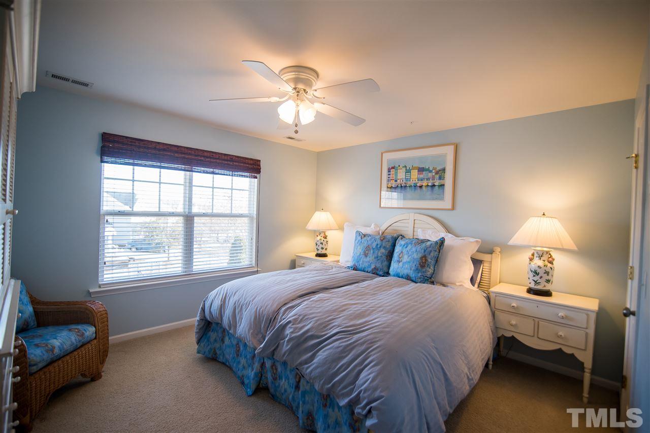 2307 Bright Future Way Raleigh, NC 27614 - Photo 17 of 23 Bedroom featuring plush carpet, ceiling fan and double windows.